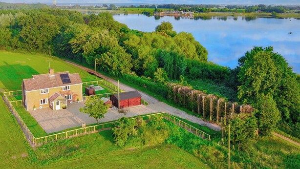 A large house with a fenced yard and a pond in the background. - Old Alton Hall Farmhouse (Holbrook, near Ipswich)