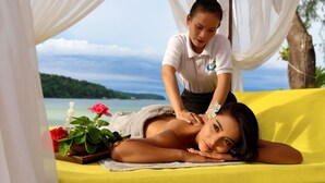 A massage therapy session with a scenic ocean view in the background. - Eden Beach Resort by EHM (Koh Rong Sanloem)