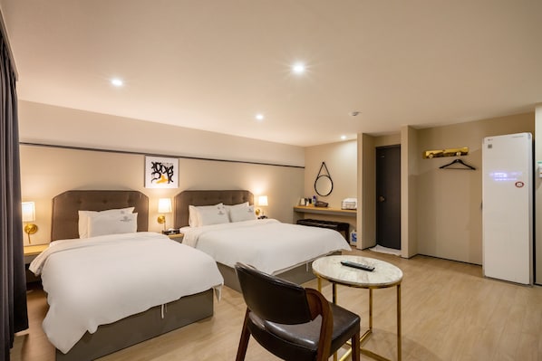VIP Twin | Premium bedding, individually decorated, desk, laptop workspace
