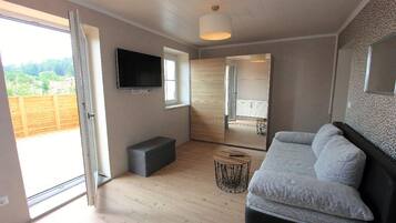 Apartment, Hot Tub | Living area | 32-inch TV with satellite channels