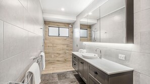 Bathtub, hair dryer, towels, soap