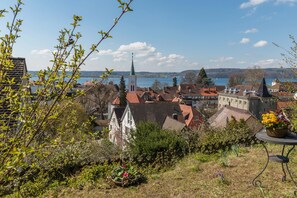 A town with a church, residential buildings, and a lake.