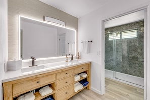 Shower, hair dryer, towels, soap