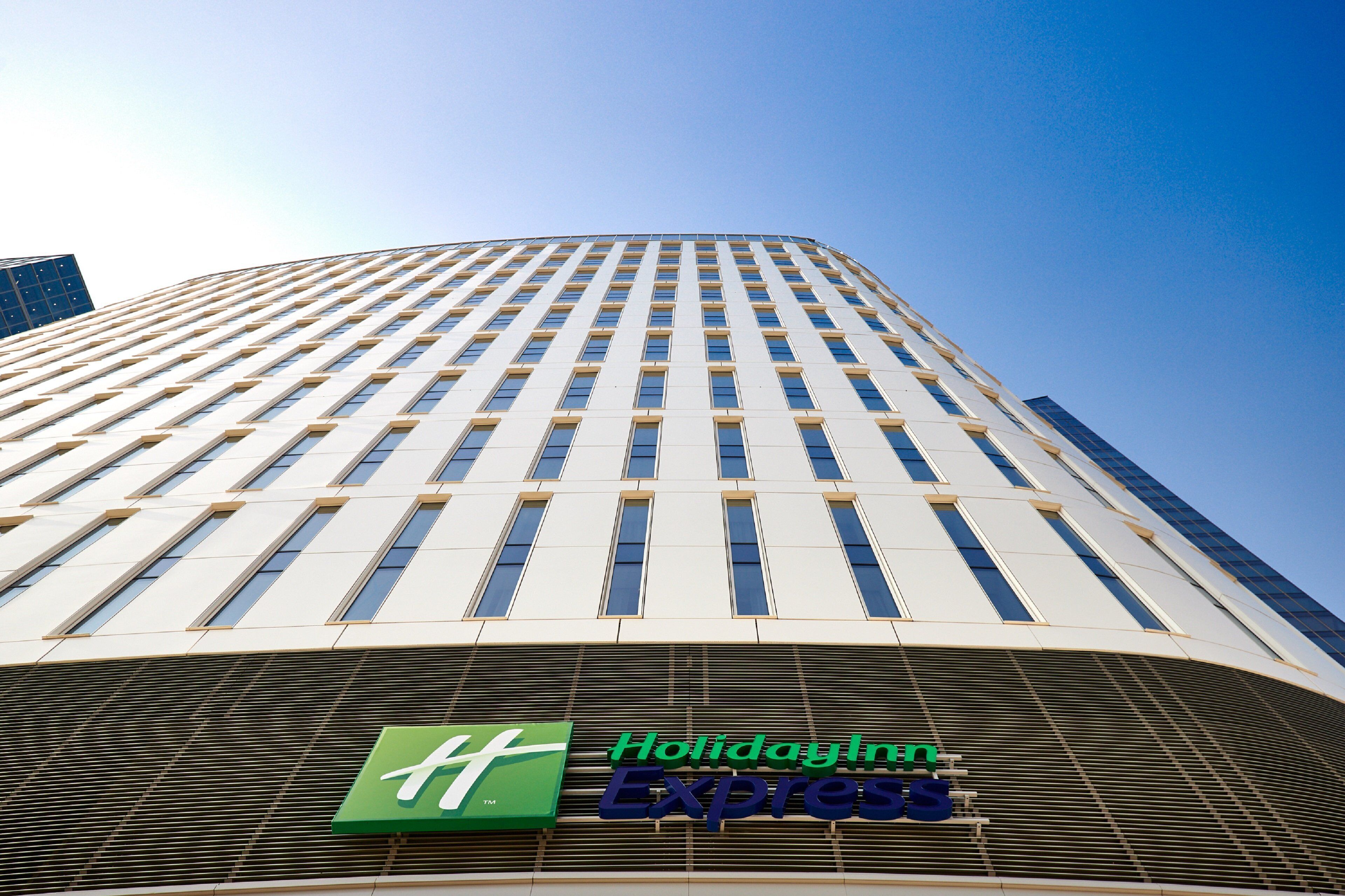 A tall building with a Holiday Inn Express sign at the bottom.