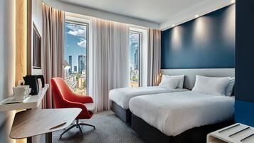 Hypo-allergenic bedding, desk, laptop workspace, blackout curtains