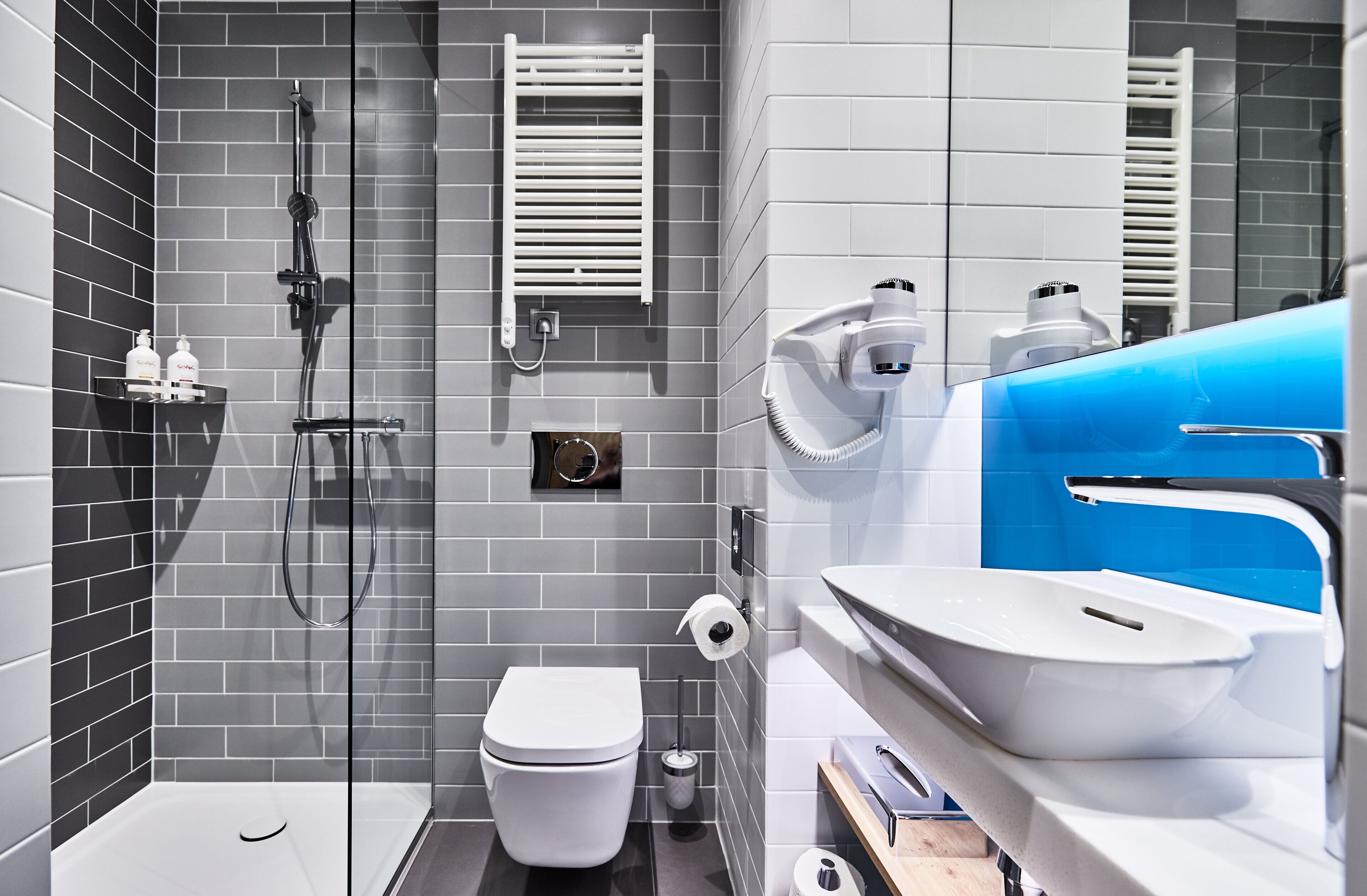 shower, hair dryer, towels, soap