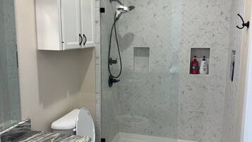 Shower, towels, soap, toilet paper