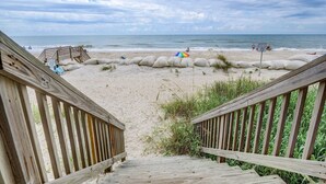 A wooden staircase leading to a sandy beach with a wooden railing. - 2284-B New River Inlet Road- Direct Oceanfront 3 bedroom- Adjoining Side is Available for Rent- 2... (North Topsail Beach)