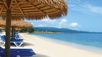 Private beach, white sand, sun loungers, beach umbrellas