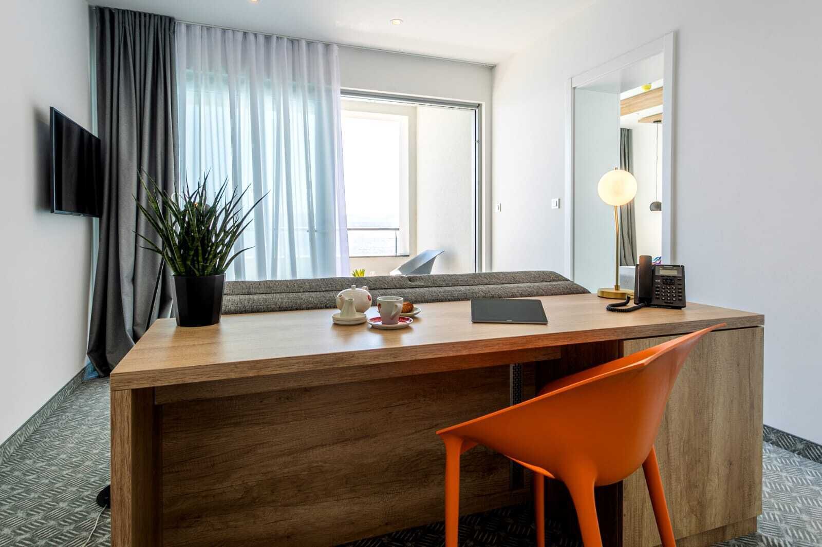 deluxe suite, balcony, sea view | living area | 80-cm lcd tv with satellite channels, tv