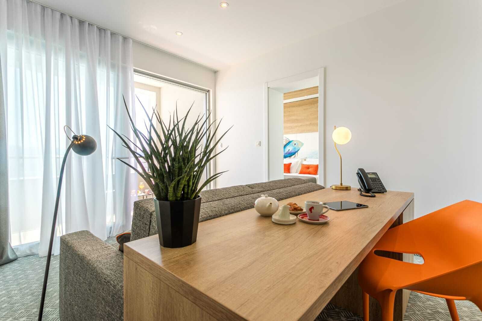 deluxe suite, balcony, sea view | living area | 80-cm lcd tv with satellite channels, tv