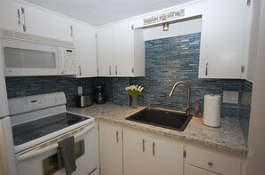 Fridge, microwave, oven, stovetop - Gorgeous Florida Coastal Renovation, Steps to the Sugar Sand Beach of FMB! (Fort Myers Beach)