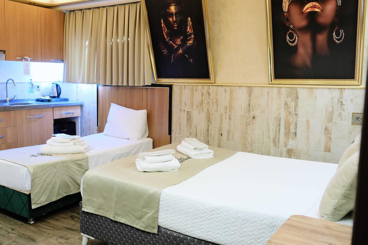 Economy Studio | Premium bedding, memory foam beds, individually decorated