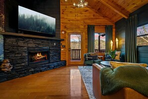 Smart-tv, een open haard, een dvd-speler en tafelvoetbal