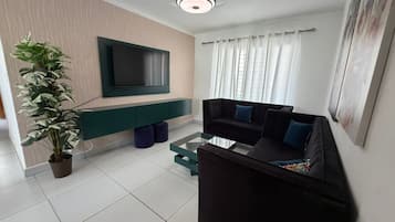Basic Apartment | Living area | 32-inch flat-screen TV with cable channels, TV