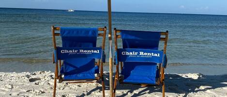 On the beach, sun-loungers