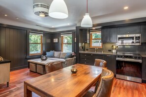 Enjoy meals in the fully equipped kitchen with a microwave and oven, and dine in comfort at the dining table.