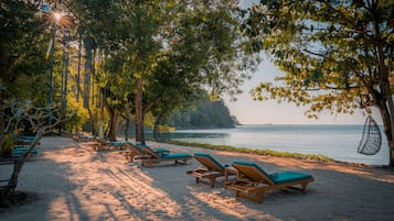 Private beach, sun loungers, beach towels, beach massages