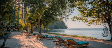 Private beach, sun loungers, beach towels, beach massages