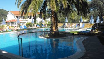 Seasonal outdoor pool, open 9:30 AM to 6:30 PM, pool loungers