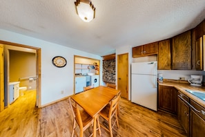 Enjoy cooking in this well-equipped kitchen with an oven, refrigerator, and sink.