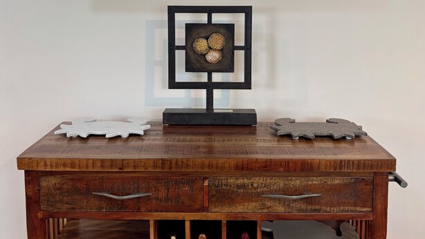 A television mounted on a wall displaying an underwater scene with sharks. Below, a wooden desk with drawers and shelves is visible. - Private Pool, HotTub and Golf Cart in the Village of Rio Grande! (The Villages)