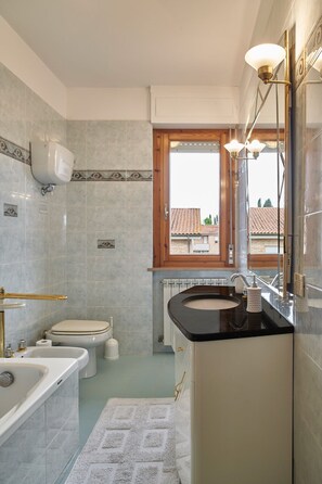 Bathtub, eco-friendly toiletries, hair dryer, bidet