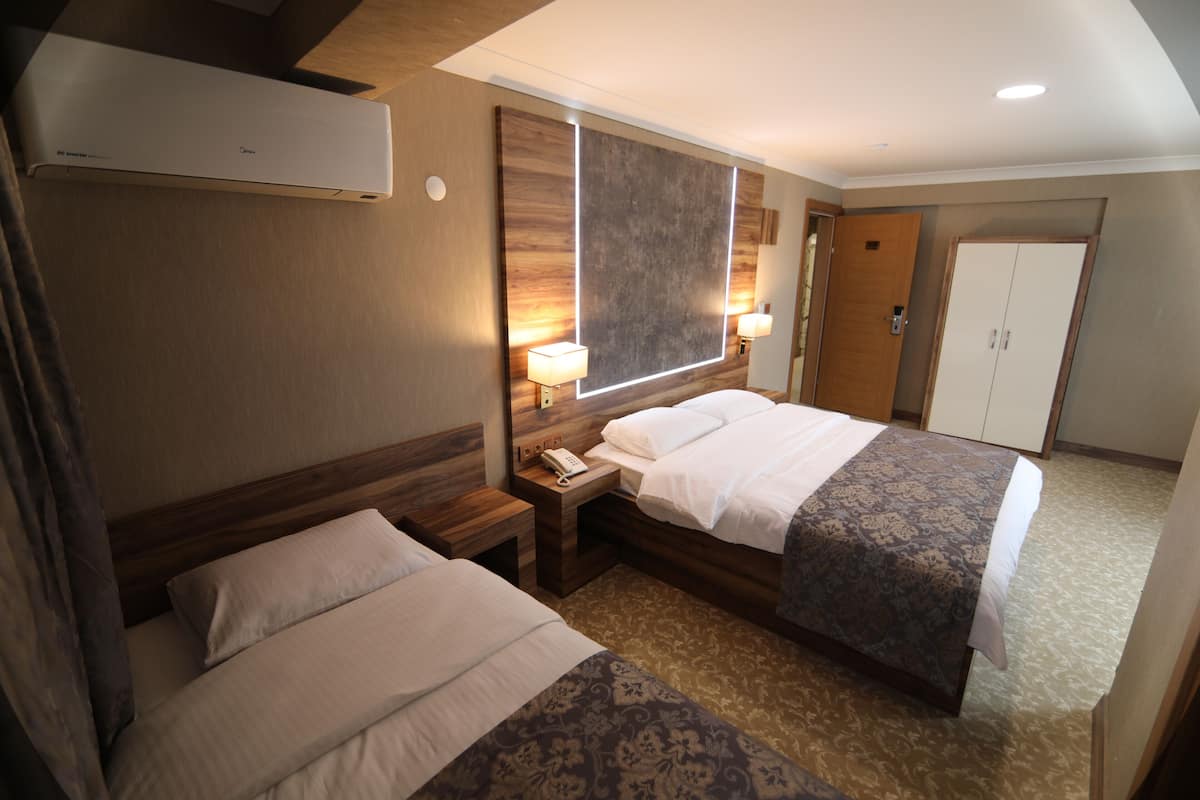 Family Triple Room | Premium bedding, down comforters, Select Comfort beds, minibar