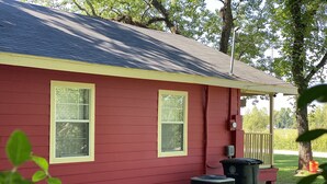 A red house with two windows and a covered porch. - My Lil Red House.... (Baton Rouge)