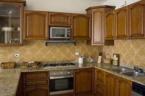 Fridge, microwave, stovetop, cookware/dishes/utensils