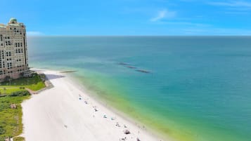 On the beach, sun loungers, beach towels