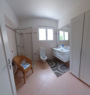 Shower, hair dryer, towels, soap