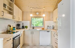 Fridge, stovetop, dishwasher, coffee/tea maker