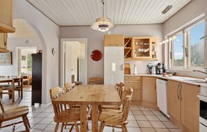 Fridge, stovetop, dishwasher, coffee/tea maker