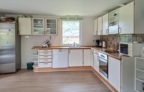 Fridge, stovetop, dishwasher, coffee/tea maker