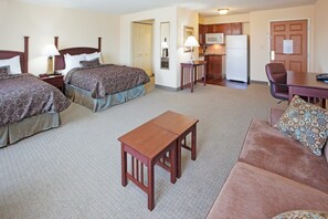 A hotel room with two beds, a small kitchenette, a dining table, and a sofa. - Studio Suite Great for Business Travelers | Shared Indoor Pool + 24h Business Center (Stafford)