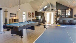 A spacious room with a pool table, ping pong table, and a billiards setup. - 8 bedroom awesome home in Thisted (Thisted)