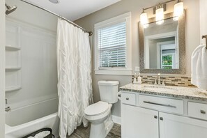 Combined shower/bathtub, hair dryer, towels, soap