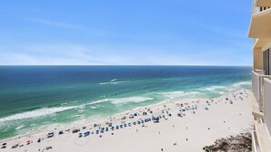 A beach view from a balcony with a clear sky, a sandy beach, and the ocean. - 🏖️XL Balcony, Great Views-3BR Boardwalk1801🏖️ (Panama City Beach)