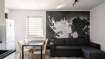 Classic Apartment | Living area | 37-inch flat-screen TV with digital channels