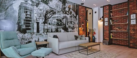 Deluxe Apartment | Living room | 125-cm flat-screen TV with cable channels, TV, heated floors