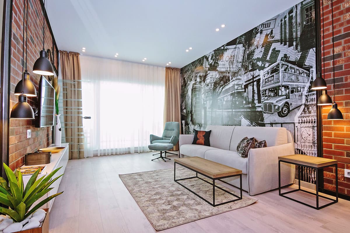 Deluxe Apartment | Living area | 125-cm flat-screen TV with cable channels, TV, heated floors