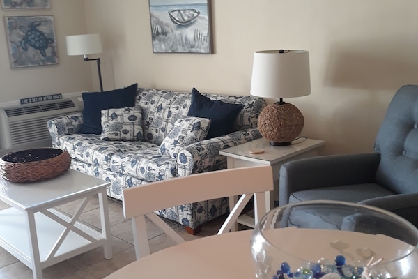 Living area with queen size pull out sofabed.