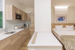 Roupas de cama premium, edredons de pluma, frigobar, cofres nos quartos