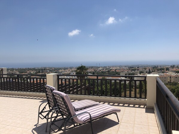 A balcony with a view of a cityscape and the sea. - Fantastic Sea View Apartment With Large Balcony (Paphos)