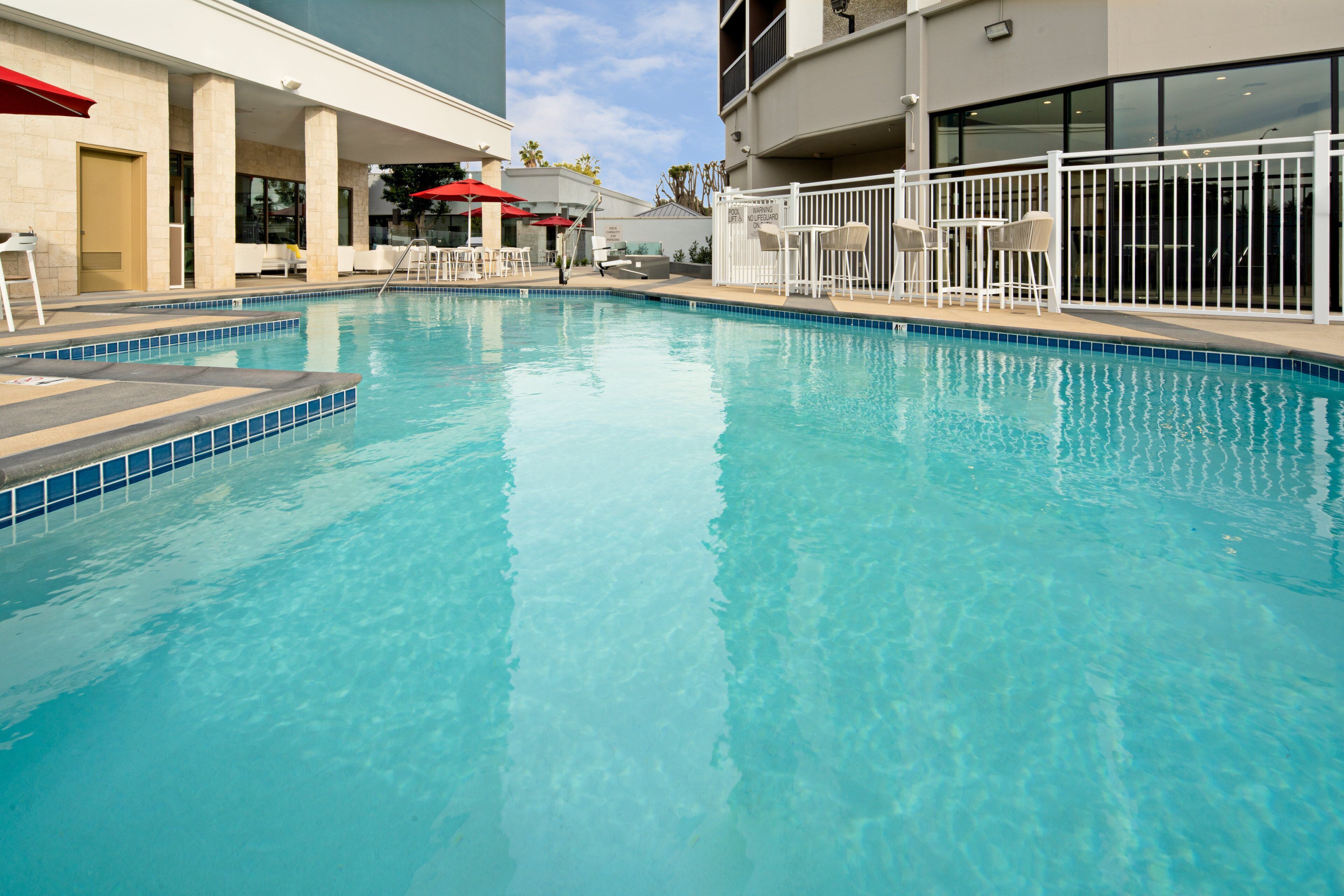 outdoor pool, open 8:00 am to 10:00 pm, pool umbrellas, pool loungers