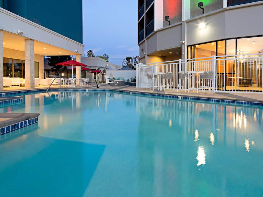 Outdoor pool, open 8:00 AM to 10:00 PM, pool umbrellas, sun loungers