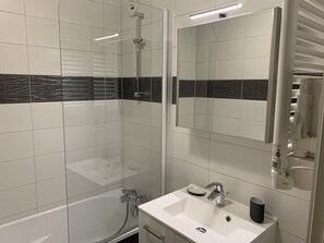Bathtub, hair dryer, soap, shampoo