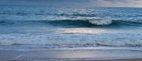 On the beach, sun loungers, beach towels