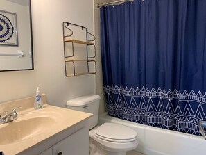 Combined shower/tub, hair dryer, towels, soap